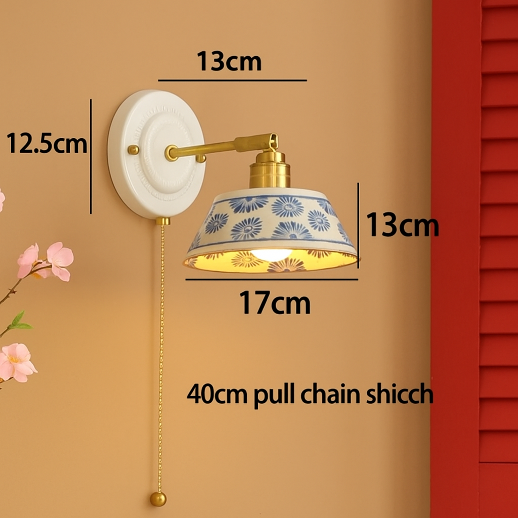 Hand-painted blue floral wall lamp with an integrated pull chain switch