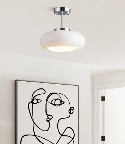 White pendant light hanging over bedroom ceiling modern design