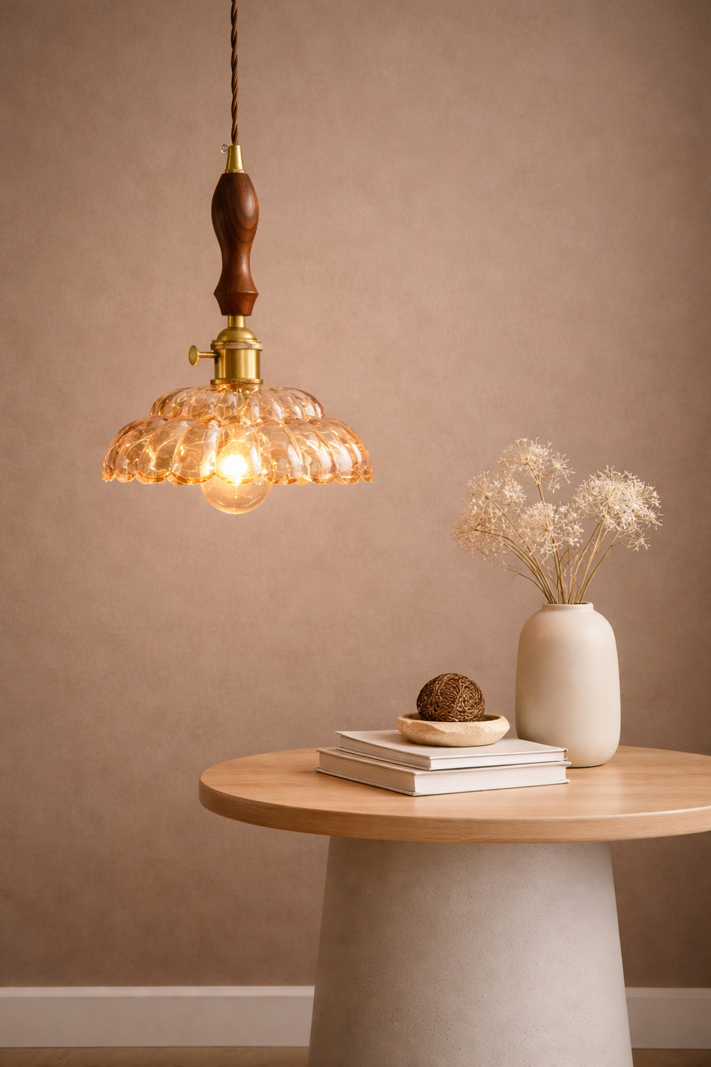 Amber glass pendant light with a retro-inspired  shade and antique brass hardware.