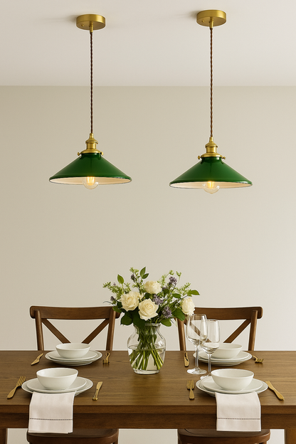 Vintage green glass pendant light with a wide retro shade and brass hardware.