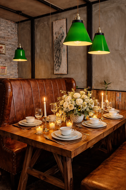 
Cone-shaped green glass pendant light fixture with a matte black finish 