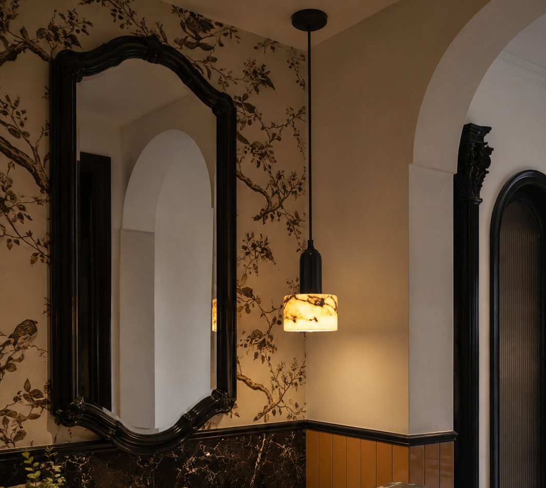 Sleek cylindrical pendant light with LED illumination installed in a contemporary bathroom, offering stylish and focused lighting for a clean modern space.