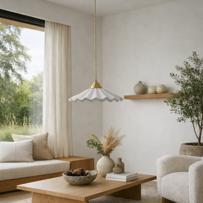 View of a living room with the Mashal Designs scalloped pendant light installed as a central fixture