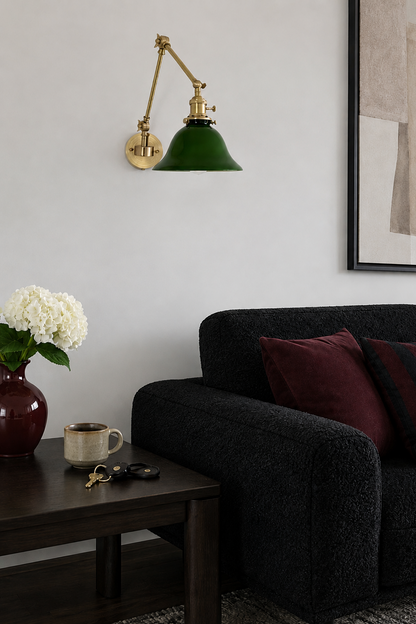 Vintage style brass wall sconce featuring a green glass banker lampshade and convenient pull chain switch