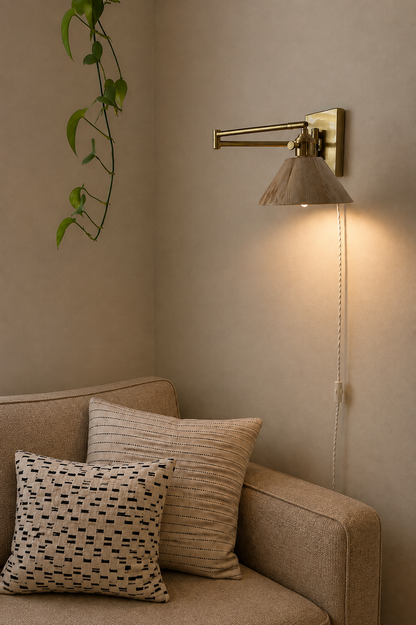 A brass Plug-In wall sconce with  a wooden lampshade