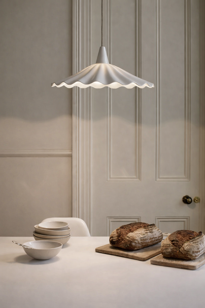 Contemporary white pendant ceiling light hanging over kitchen Island