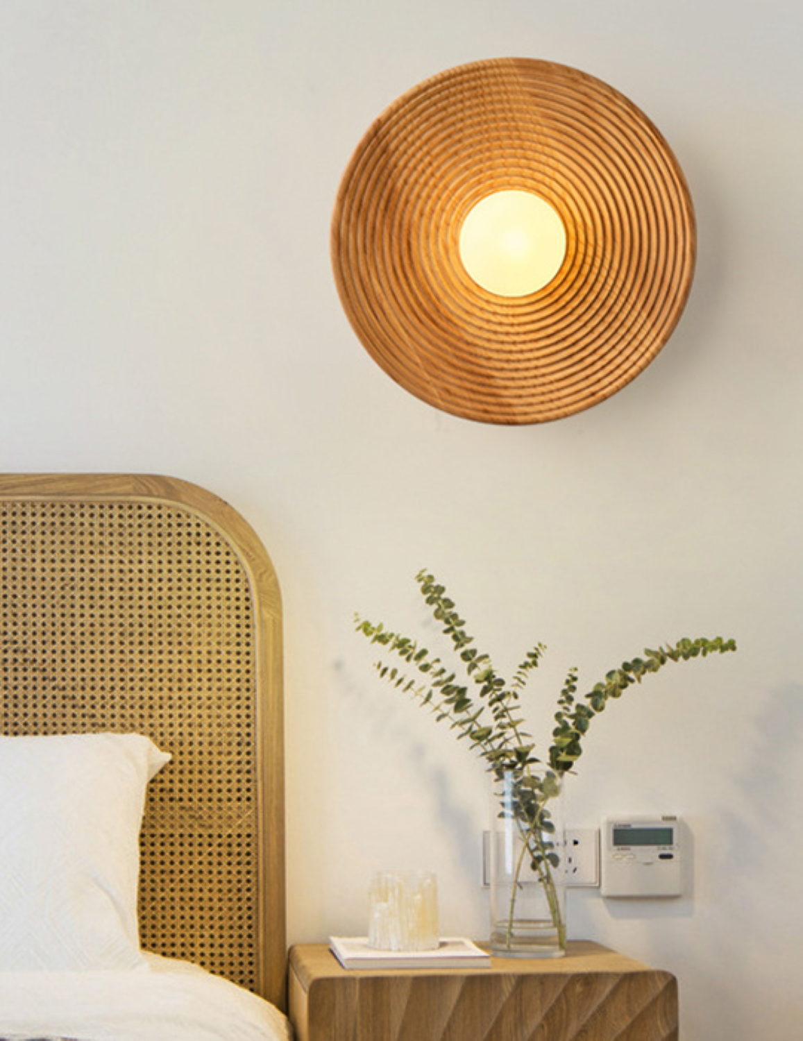 Light oak wood 30cm round wall light showing on bedside wall