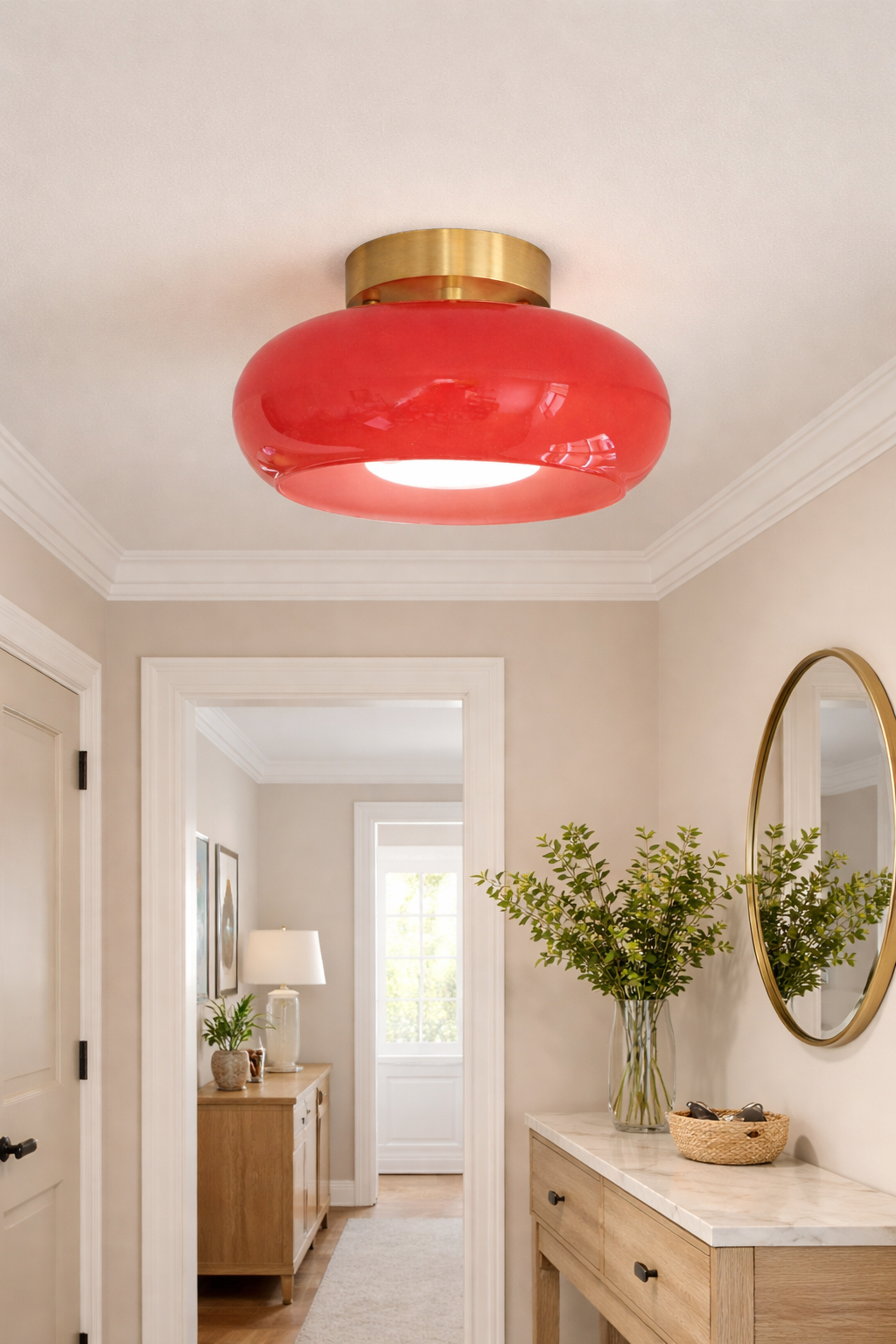 Antique brass and red glass flush mount ceiling light fixture installed at entryway – A classic round-shaped glass fixture with aged brass hardware.