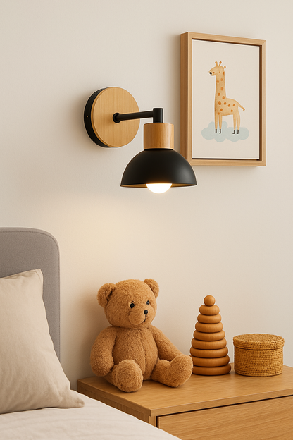 A minimalist black wall light made of iron and wood, installed in a child's bedroom